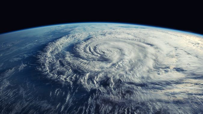 A satellite view from space of a hurricane viewed at about 45 degrees from top-down